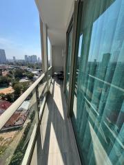 Compact balcony with city view and seating area