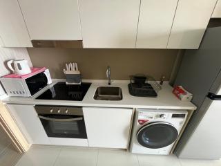 Modern kitchen with appliances and white cabinetry