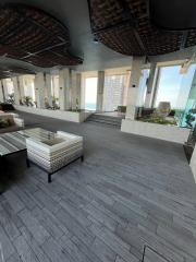 Spacious and modern community lounge area with ocean view