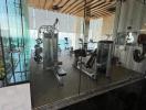 Modern home gym with glass walls and ocean view