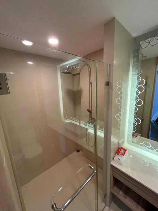 Modern bathroom interior with glass shower enclosure