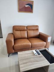 Modern living room with a comfortable leather sofa and stylish coffee table