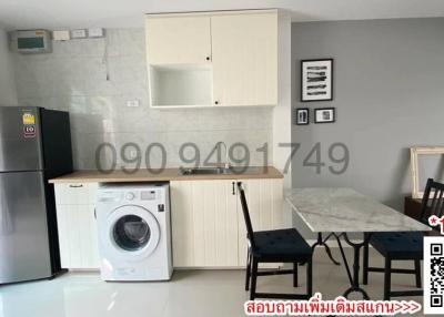 Modern kitchen with appliances and dining area