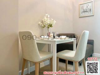 Cozy dining area with modern furniture and decorative flowers
