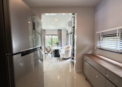 Modern kitchen with open plan layout leading to a dining area