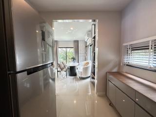 Modern kitchen with open plan layout leading to a dining area