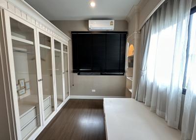 Modern bedroom with built-in wardrobes and air conditioning