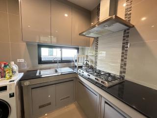 Modern kitchen with stainless steel appliances and granite countertop