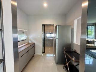 Modern kitchen with stainless steel appliances and bright interior