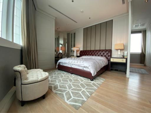 Elegant modern bedroom with a large bed and ample lighting