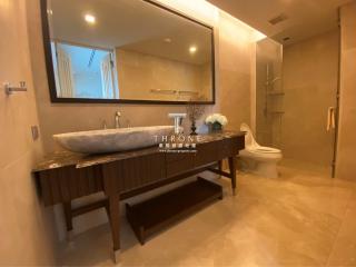 Modern bathroom with large vanity and walk-in shower