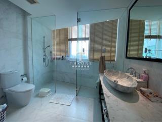 Modern bathroom interior with glass shower and elegant basin