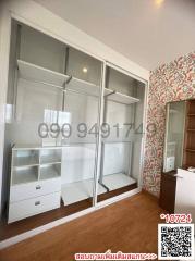 Modern bedroom with built-in wardrobe and floral wallpaper