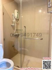 Modern bathroom interior with glass shower enclosure