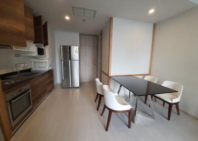 Modern kitchen and dining area with stainless steel appliances