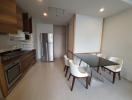 Modern kitchen and dining area with stainless steel appliances