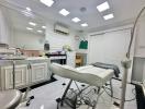 Modern medical examination room with white interior and professional equipment