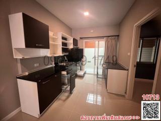 Modern kitchen with stainless steel appliances and ample shelving