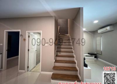 Modern interior with a staircase, lighting, and air conditioning