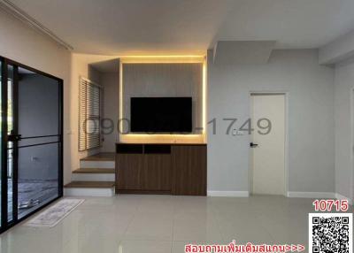 Modern living room interior with television and LED backlighting