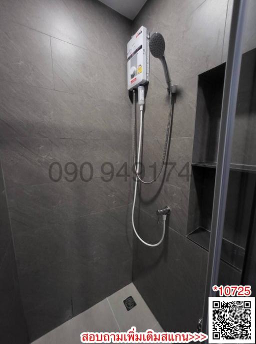 Modern bathroom with gray tiles and wall-mounted shower