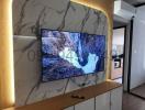 Modern living room interior with marble wall-mounted TV unit