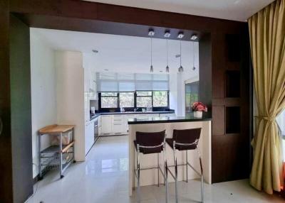Modern kitchen with breakfast bar and ample natural light