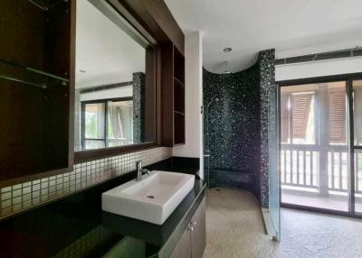 Spacious bathroom interior with modern sink and large mirror