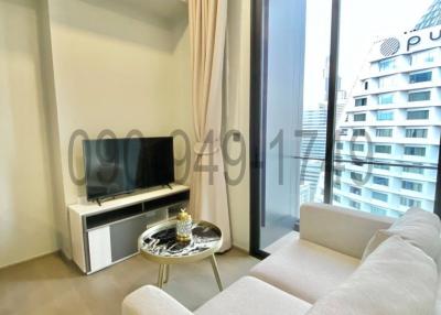 Modern living room with city view through large window