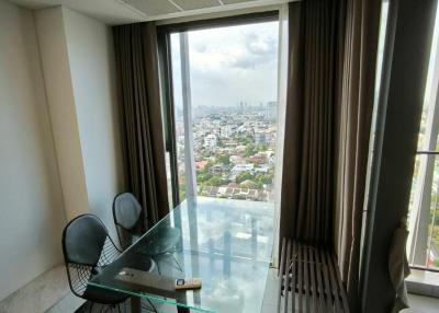 High-rise apartment dining area with city view