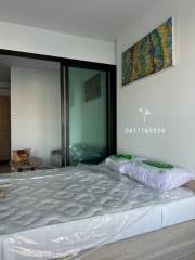 Modern bedroom with large bed and artistic wall decor