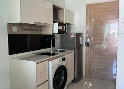 Modern kitchen with appliances and washing machine