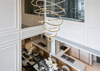 Elegant living room with high ceiling and modern chandelier