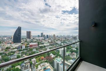 City view from a high-rise balcony with clear skies