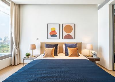 Modern bedroom with large bed and artwork