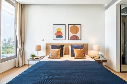 Modern bedroom with large bed and artwork
