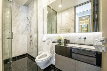 Modern bathroom with marble tiles and elegant fixtures