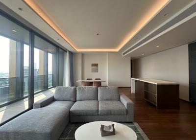 Spacious modern living room with large windows and city view