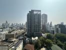 View of a modern urban skyline with multiple high-rise buildings under clear skies