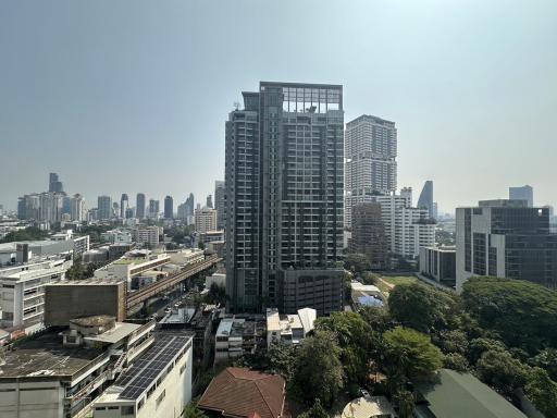 View of a modern urban skyline with multiple high-rise buildings under clear skies