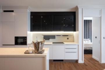 Modern kitchen with open plan leading into the bedroom