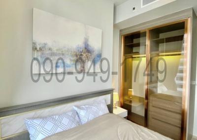 Modern bedroom interior with artwork and wardrobe