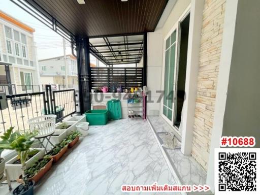 Spacious balcony with protective cover and modern tiled flooring