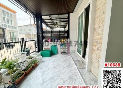 Spacious balcony with protective cover and modern tiled flooring