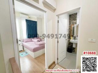 View of a cozy bedroom and bathroom in a modern apartment