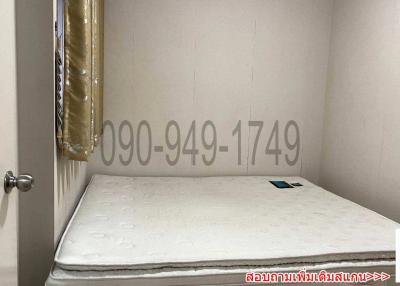 Small unfurnished bedroom with a single mattress on the floor