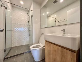 Modern bathroom with walk-in shower and wooden vanity