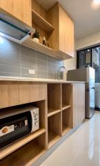 Modern kitchen with wooden cabinets and built-in appliances