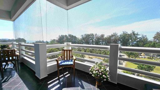 Spacious balcony with outdoor furniture and scenic view