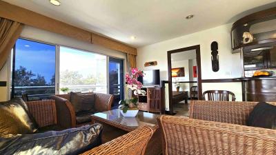 Spacious living room with comfortable seating and large windows